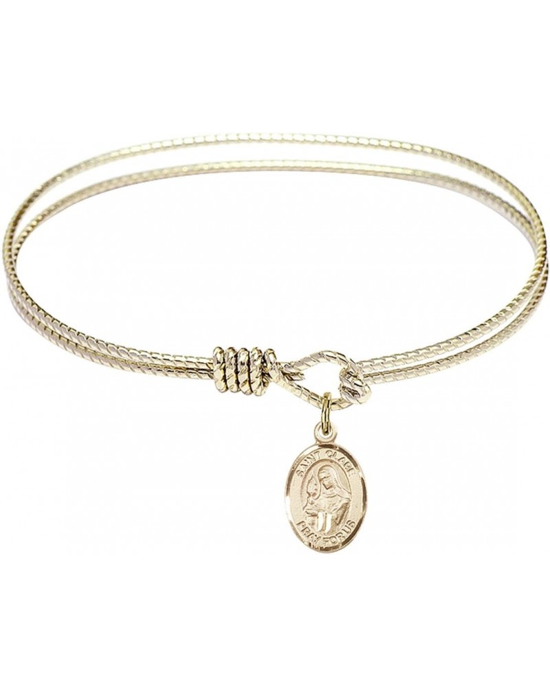 6 1/4 inch Oval Eye Hook Bangle Bracelet with a St. Clare of Assisi Charm. $37.08 Bracelets